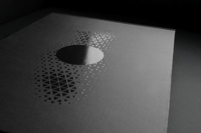 Text printed on corrugated cardboard with spot UV gloss.
